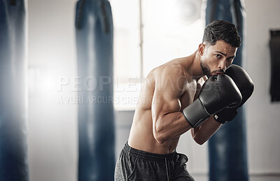 Buy stock photo Boxing gym, man portrait and boxer pose technique for protection in mma fight practice studio. Exercise, fitness and athlete focus training for kickboxing safety and wellness preparation.