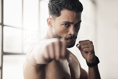 Buy stock photo Energy, power and boxing by man fist punch in a gym or fitness studio. Portrait of athletic boxer workout or exercise, endurance and speed preparation before a kickboxing, competitive match