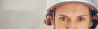 Buy stock photo Portrait of a woman with helmet for hiking sport with a zoom in of eyes. Safety, secure and helmet for rock climbing in nature. Copy space for outdoor sports, fit and active female 