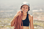 Sports woman, helmet and ropes for mountain or rock climbing and hiking adventure outdoors. Exercise, fitness and extreme climber with a smile feeling adrenaline and motivated for extreme sport
