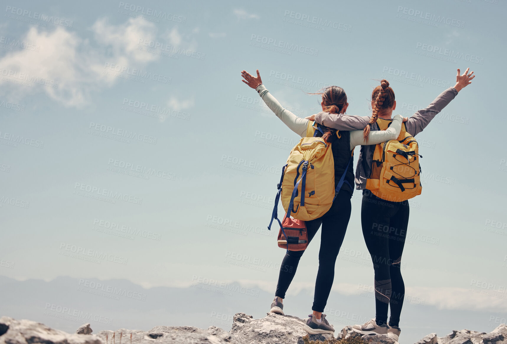 Buy stock photo Hiking friends celebrate climbing mountain peak together on rocky summit as healthy, fitness and trekking women. Success, freedom and happy climbers adventure, challenge or journey with mockup space