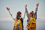 Women travel on outdoor adventure, support achievement and hiking success to mountain top peak. Blue sky landscape, best friends love nature, sunshine at peak and calm freedom of girl sisters trip