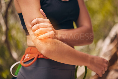 Buy stock photo Woman, arm injury and pain while hiking, mountain climbing or fitness training outdoors in nature. Female sports athlete with medical joint inflammation from intense exercise in the countryside.