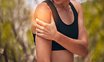 Hand, pain and injury with a sports woman holding her arm and shoulder with overlay outside for exercise, health and fitness. Training, medical and workout with a female athlete suffering with hurt