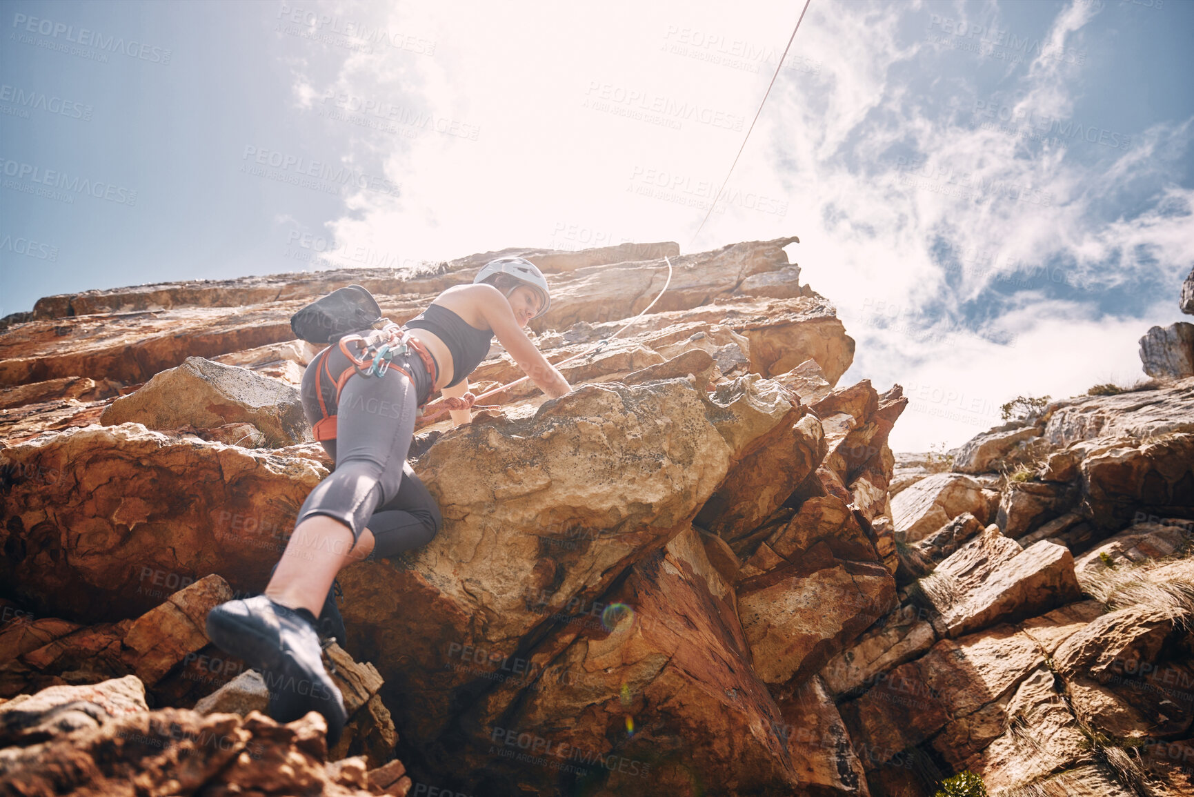 Buy stock photo Fitness, extreme sports and rock climbing woman on a mountain, enjoy a climb in nature and freedom. Athlete, adrenaline and energy with female on adventure, physical challenge exercise cliff hanging