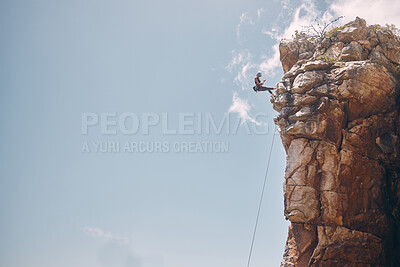Buy stock photo Mockup blue sky, mountain climbing woman and rock wall fearless hiking on abseiling training rope outdoor. Healthy fitness risk, adventure freedom challenge and strong surreal nature for sports cliff