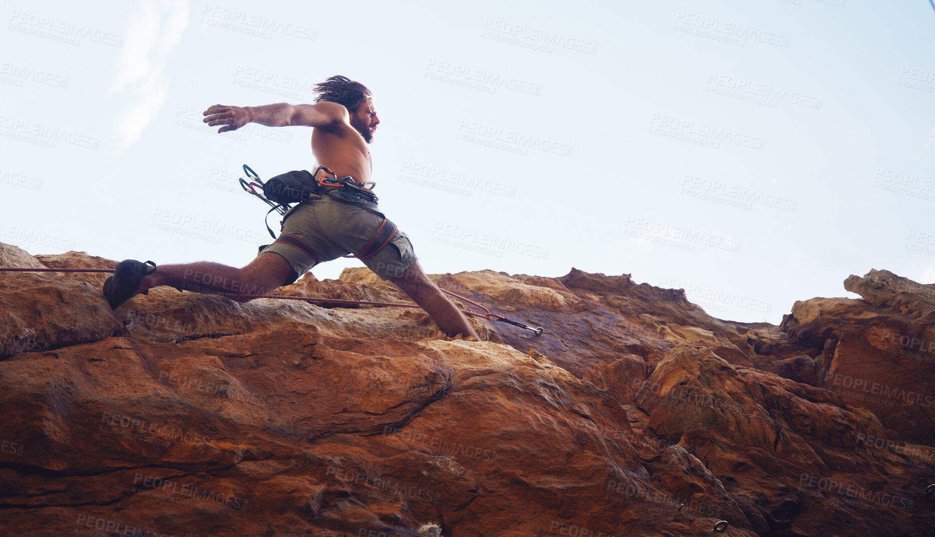 Buy stock photo Mountain, sport and climbing with a sports man running along a rocky surface for health, fitness and exercise. Workout, training and cardio with a young male climber athlete in the mountains