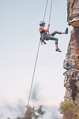 Buy stock photo Woman climbing mountain with rope, outdoor nature activity and fitness exercise. Cliff rock climb, mountaineering adventure and action danger risk. Safety gear, peaceful earth and freedom motivation