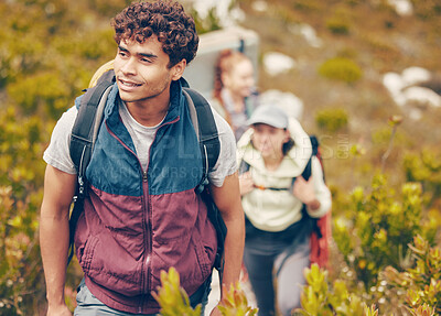 Buy stock photo Hiking, friends and adventure with a group of young people wearing backpacks during travel, adventure and nature journey. Active, fitness and exercise with a happy man trekking to explore with mates