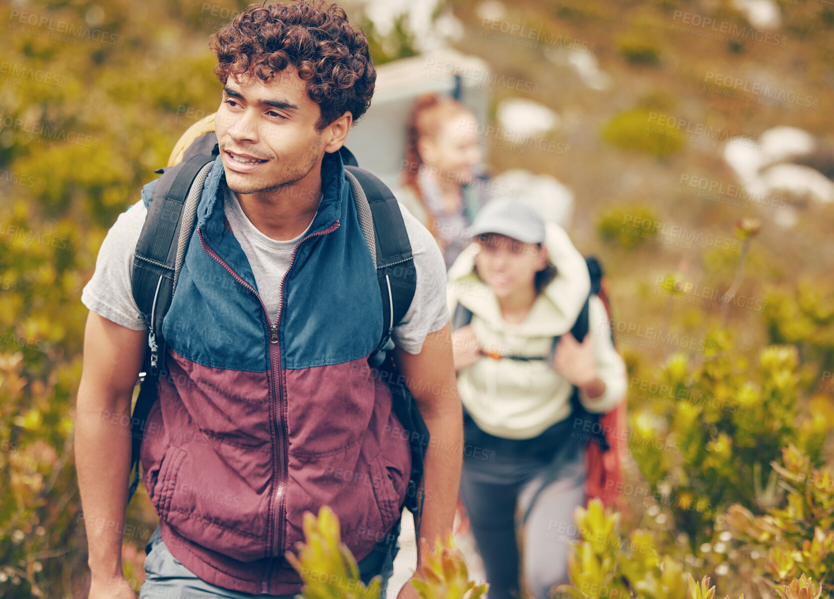 Buy stock photo Hiking, friends and adventure with a group of young people wearing backpacks during travel, adventure and nature journey. Active, fitness and exercise with a happy man trekking to explore with mates
