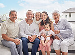 Big family portrait, children with grandparents at summer holiday vacation on sofa with blue sky. Happy Mexico mother, interracial father and kids or baby bonding together on outdoor patio break