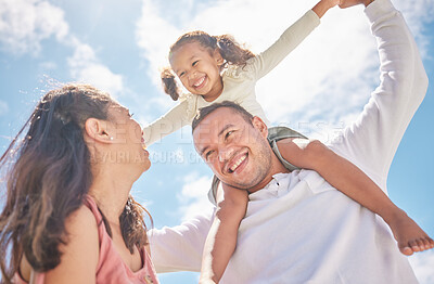 Buy stock photo Children, family and love with a girl on the shoulders of her dad outside with her mother watching on against a blue sky. Kids, happy and smile with a daughter having fun with her parents outdoor
