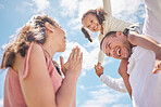 Family, play and love with child on shoulder of father against the blue sky for childhood, bond and care. Happy, summer and freedom with young girl, dad and mom together for joy, fun and youth