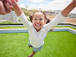Girl child happy, fun outdoor garden and parent hand swinging kid by arms in circle movement. Family play game on green grass landscape park, young happiness and kids funny smile of father pov