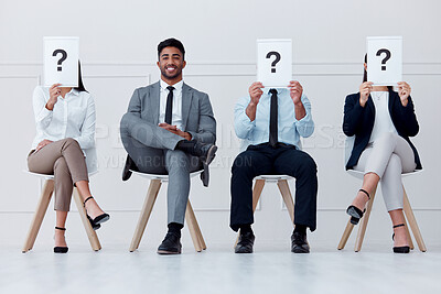 Buy stock photo Man at recruitment company and question with smile, job interview or hiring with manager or boss to join team of workers. Happy male in group with people for job at business or office for work growth