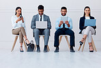 Business people, hiring row and tech with some on mobile, laptop or tablet. Happy corporate workers, group or candidates on technology, computer or phone sitting and waiting for a job interview.