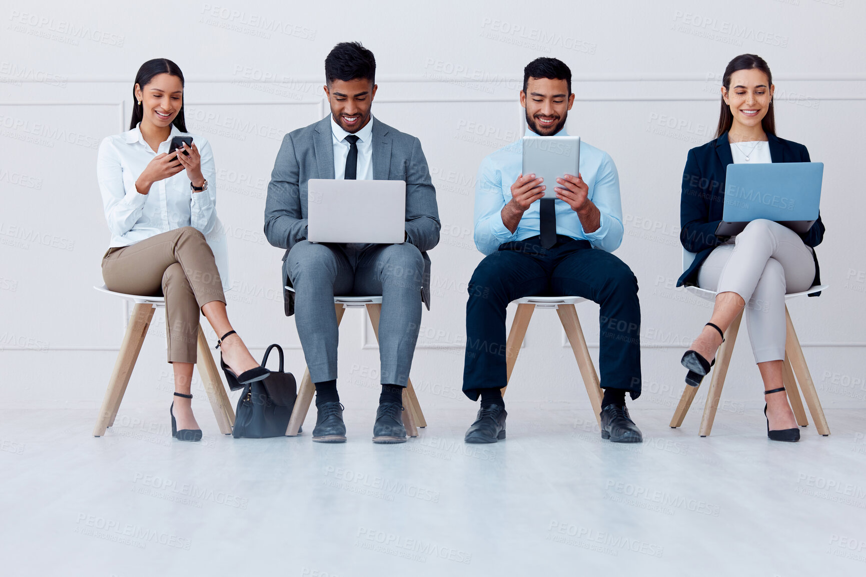 Buy stock photo Business people, waiting room and tech with some on mobile, laptop or tablet. Happy workers, group or candidates on technology, computer or phone waiting for a job interview, hiring or recruitment.