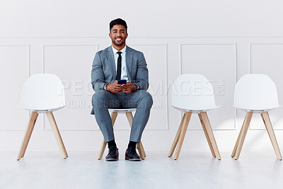 Buy stock photo We are hiring, interview and business man worker waiting for a company management meeting. Portrait of a businessman smile from India on his phone ready for hire process in a office with motivation
