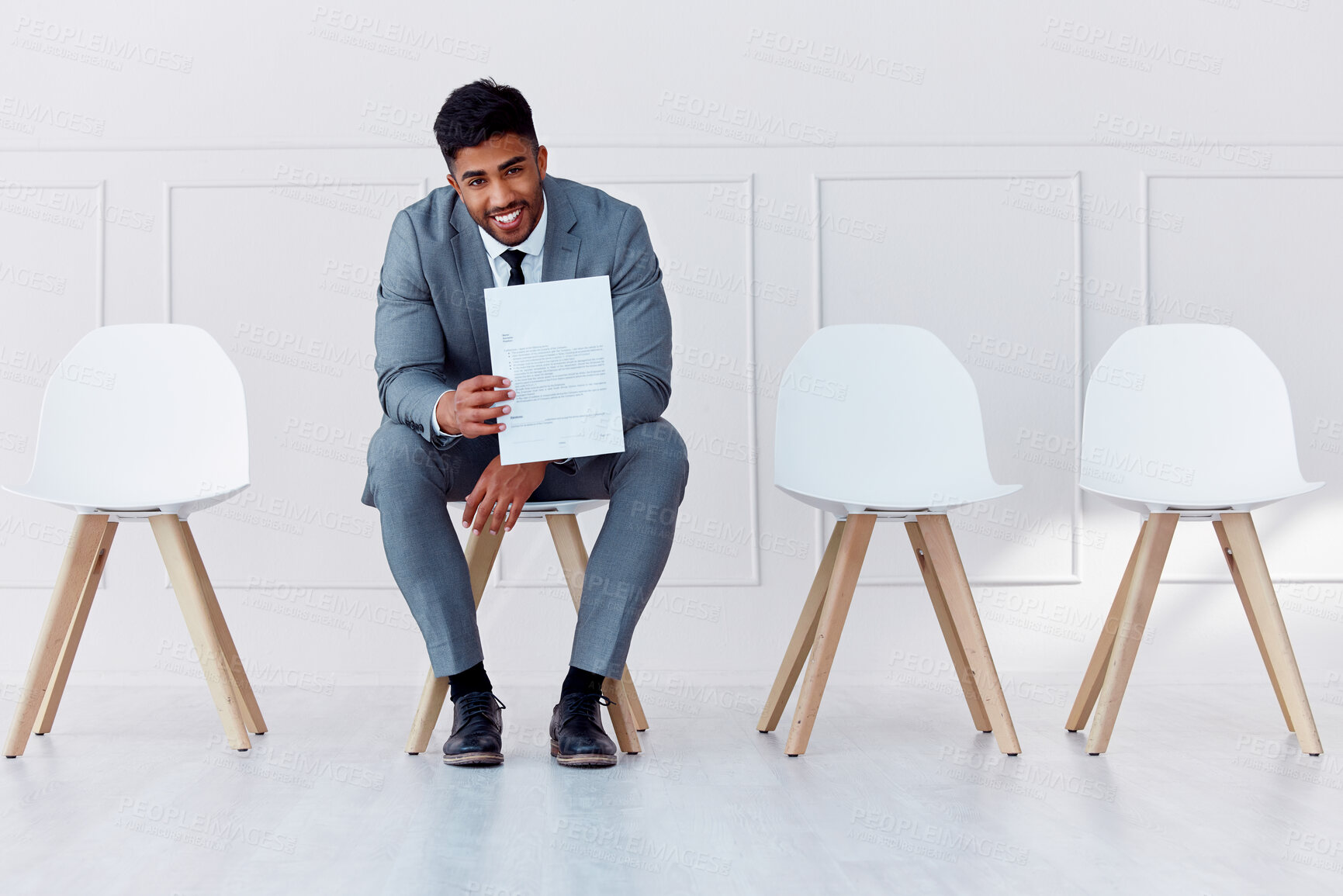 Buy stock photo Hiring, recruitment and business man in a waiting room for a corporate company job interview. Happy, smile and confident career businessman with professional cv ready for job, interview or recruiting