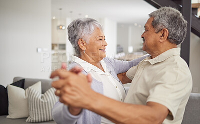 Buy stock photo Love, dancing and happiness with a senior couple being playful and romantic while celebrating their anniversary or retirement at home. Happy man and woman bonding together in a healthy relationship
