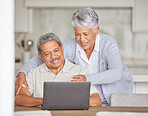 Retirement, laptop and senior couple on the internet reading an email, news or video call via a social network website. Happy elderly woman with a relaxed husband streaming or browsing online at home