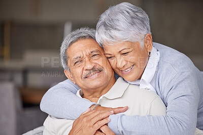 Buy stock photo Living room, love and senior couple hug on sofa for romantic embrace while they relax together in home. Care, trust and happiness in married relationship with partner in sweet marriage and commitment