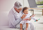 Family, book and reading with grandma and baby relax on sofa in the morning for story, learning and happiness. Love, happy and education with grandmother and girl with story for care, creative or joy