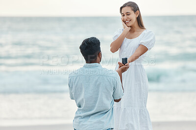 Buy stock photo Love, beach and a proposal, a couple with engagement ring by the ocean. She said yes, woman and man at the sea with diamond ring. Wow, hope for future relationship and a summer marriage announcement.