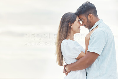 Buy stock photo Date, love and couple at the beach hug, look in eyes and bonding together for anniversary, engagement or valentines day with mock up or copy space. Happy, intimate woman or people at outdoor vacation