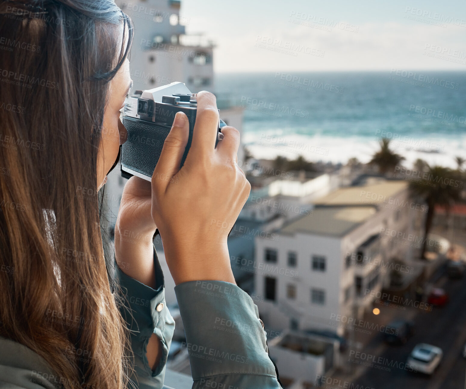 Buy stock photo Travel, view and woman with camera at hotel taking pictures of the city, buildings or ocean on vacation. Photographer, girl on balcony taking photo for happy memory, memories or moments.