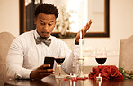 Confused, fine dining and black man on a phone speaking to his late date. Internet video call of a guy at a restaurant with roses using technology to ask a why question and time she will arrive