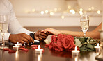 Love, engagement and couple holding hands at with wedding ring at restaurant table for proposal, date and celebration. Romance, champagne and happiness with diamond jewellery for marriage