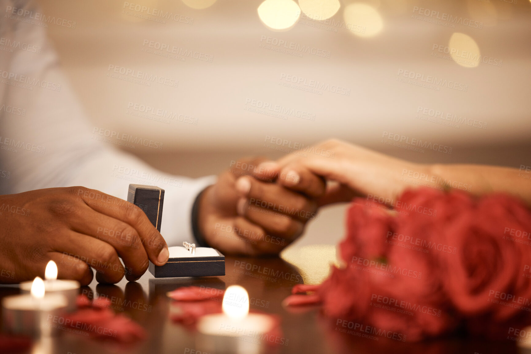 Buy stock photo Ring, hands and engagement with a couple on a date and getting engaged as fiance by candlelight. Love, question and marriage with a proposal between a man and woman in a restaurant for romance