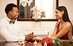 Marriage proposal, ring and couple on a date at a restaurant with roses, gift and celebration for valentines day. Engagement jewellery, young black man, woman or people at luxury venue and happiness