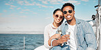 Couple with sunglasses on luxury yacht travel, champagne outdoor rich experience and ocean summer holiday. Young woman happy on vacation, man with rich smile and wealth lifestyle at sea together