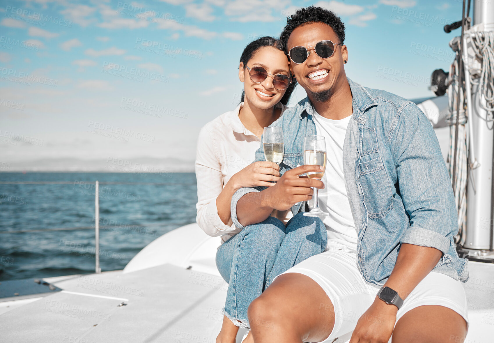 Buy stock photo Happy couple on yacht with champagne smile and celebrate love with romantic tropical holiday travel on ocean. Dating man and woman on luxury boat on beach water or sea with wine glass for celebration