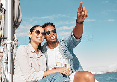 Buy stock photo Couple, champagne and pointing on luxury yacht for summer holiday, anniversary celebration and travel in Monaco. Smile, happy or love bond man and woman on ocean or sea water boat for relax honeymoon