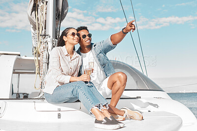 Buy stock photo Happy couple, travel and yacht in the ocean for a summer romance on lovely luxury holiday vacation. Smile, sunglasses and young woman enjoying champagne with boyfriend sailing on a cruise date at sea