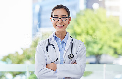 Buy stock photo Healthcare, proud and doctor woman portrait with stethoscope in a hospital with bokeh and lens flare. Care, trust and mission of a young medical professional expert or worker with wellness motivation