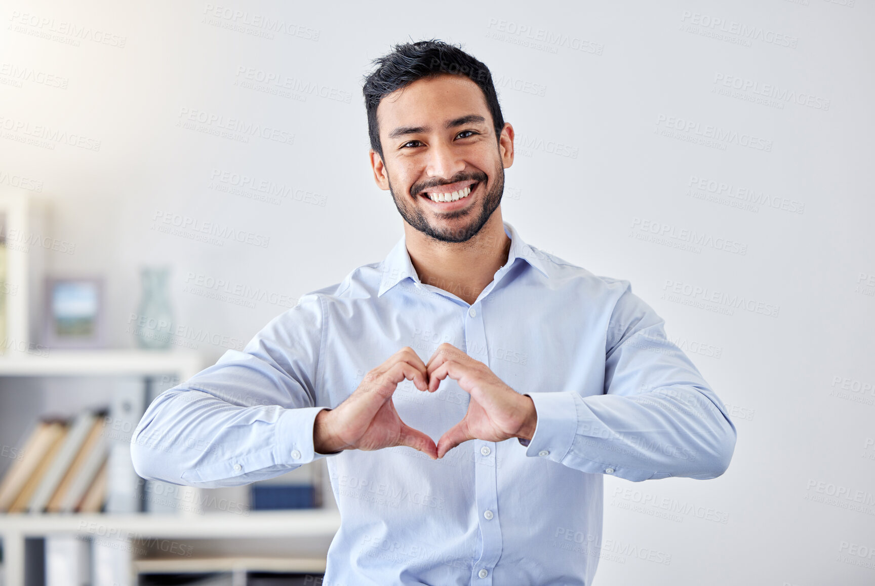 Buy stock photo Asian businessman, heart sign and hand gesture emoji for support, trust and passion for success. Portrait of smile, happy or motivation worker for charity, community love or help for people in office