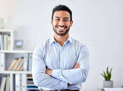 Buy stock photo Portrait of a businessman with a smile in a corporate modern office of a startup company. Happy, career and professional manager or entrepreneur standing with his arms crossed in his workspace.