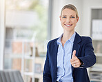 Thumbs up, thank you and motivation with a business woman saying yes in support of an achievement. Winner, success and goal with an attractive young female employee with a smile in her office at work