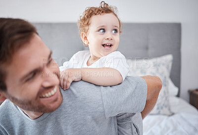 Buy stock photo Family, love and playful man and his baby bonding in the bedroom of their home together. Children, kids and father with a single parent and his son on a bed inside their house on the weekend
