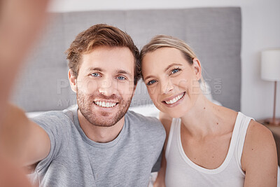 Buy stock photo A selfie in bedroom of man and woman as couple. Portrait of young, happy and smiling people taking a picture together in the morning and wearing pajamas. Taking a photo with smile, bonding and love