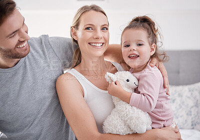 Buy stock photo Family, love and children with a mother, father and girl sitting on a bed in their home together during the morning. Kids, parents and happy with a woman, man and their daughter relaxing in a bedroom