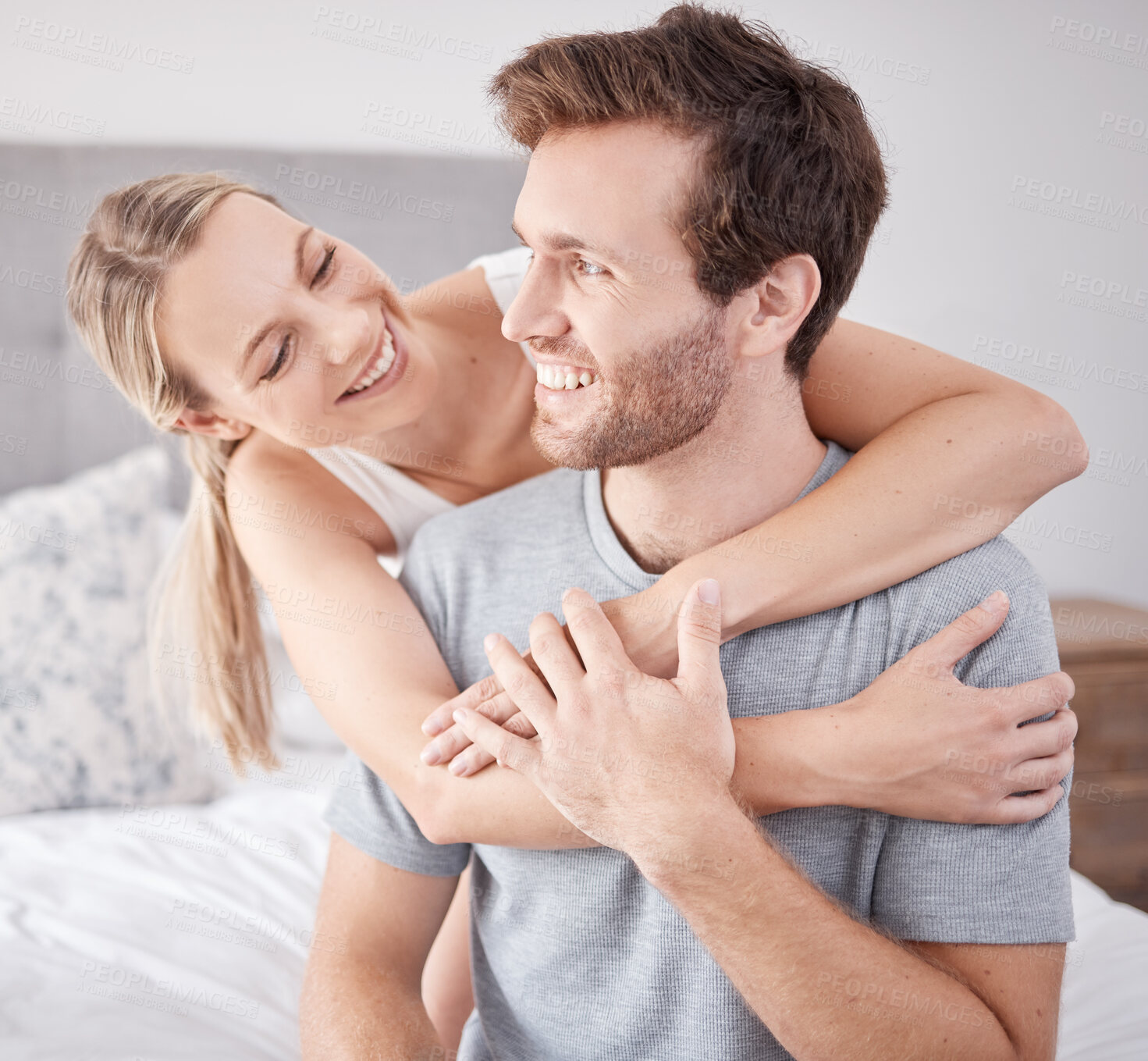 Buy stock photo Couple, hug and love bond in bedroom, house or home while on holiday or vacation. Smile, happy and fun man and woman or relax boyfriend and girlfriend in hotel in security, trust and safety