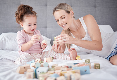 Buy stock photo Bed, happy mother and baby with toys play together with alphabet education building blocks in home bedroom. Family love, child development and fun for learning little girl or kid bonding with mom