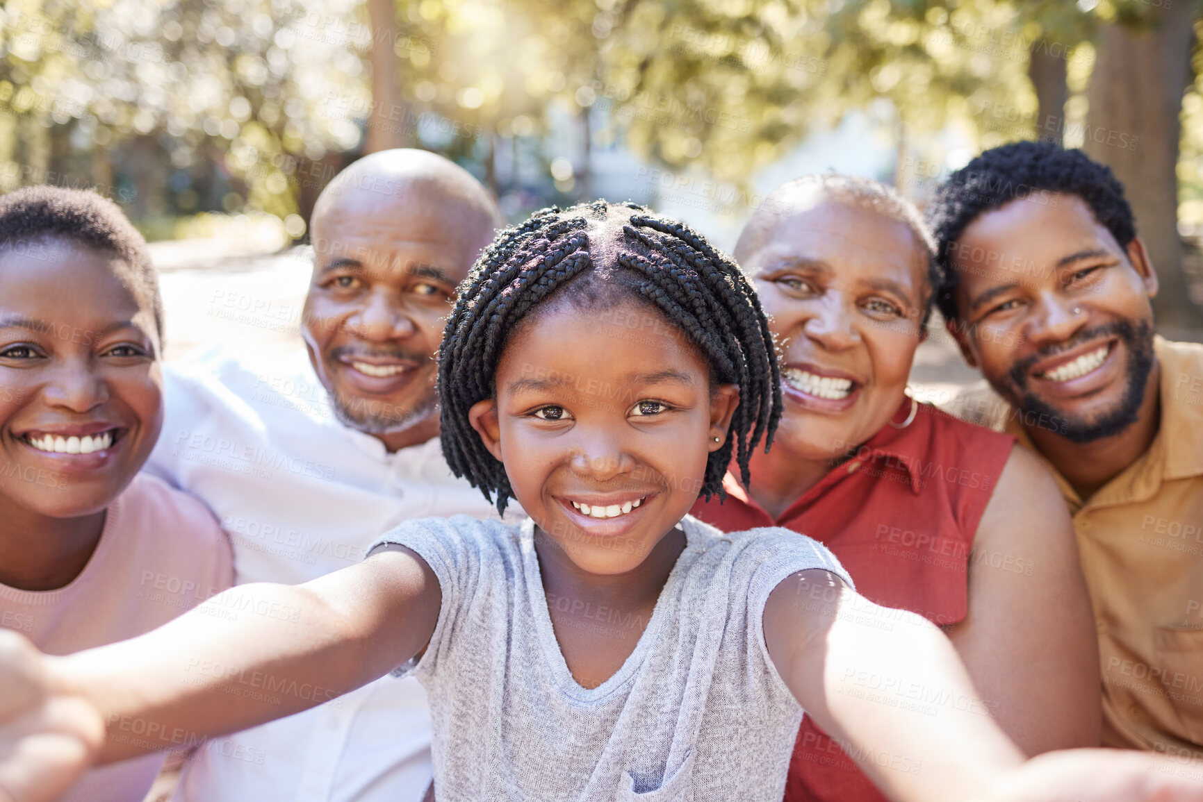 Buy stock photo Black family, selfie and smile of child taking a picture with her parents and grandparents outside at a park in nature. Portrait of a girl having fun, love and bonding with family feeling happy 