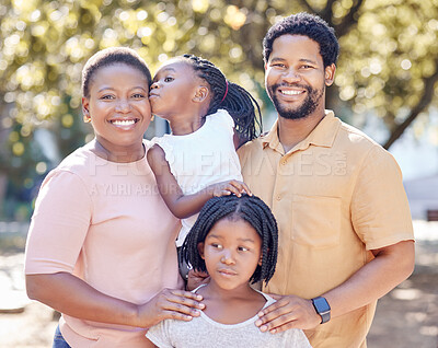 Buy stock photo Black family, outdoor fun and smile of parents bonding and spending free time with their children on a sunny day. Portrait of happy man and woman standing in a park or nature with their cute girls 