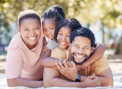 Buy stock photo African family smile at the park, having fun in summer sunshine and enjoying nature on holiday. Black African man, woman and children smiling. Kids hug dad, to bond with parent in garden